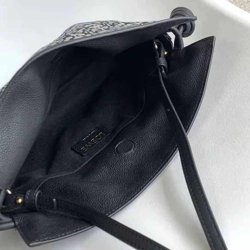 Loewe Mini Flamenco Clutch in Anagram Jacquard and Calfskin for Women in Black