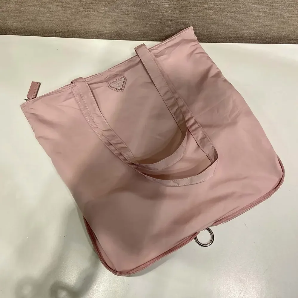 Prada Saffiano Leather Pendant With Re-Nylon Tote Bag for Women in Peach Prada Saffiano Leather Pendant With Re-Nylon Tote Bag for Women in Peach