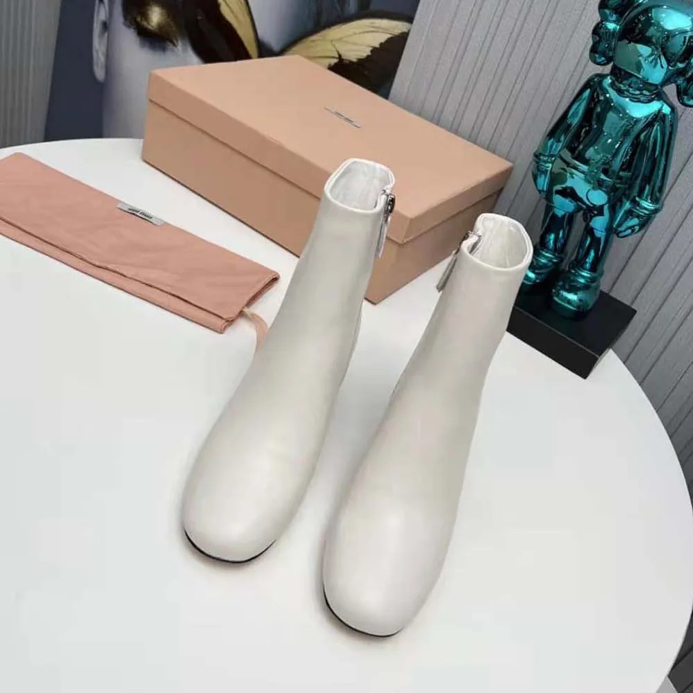 Miu Miu Leather Booties with Metal Lettering Logo for Women in White