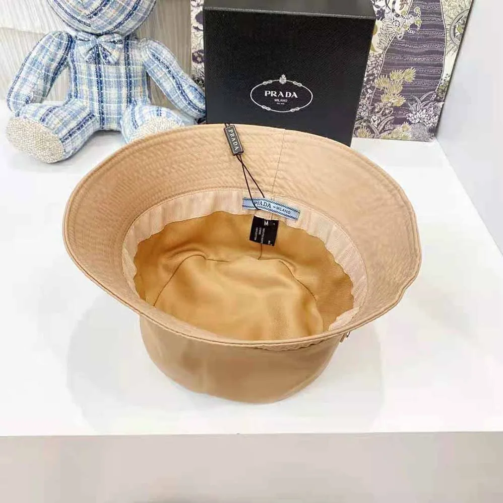 Prada Nylon Bucket Hat Decorated with the Triangle Logo for Women in Sandy Prada Nylon Bucket Hat Decorated with the Triangle Logo for Women in Sandy