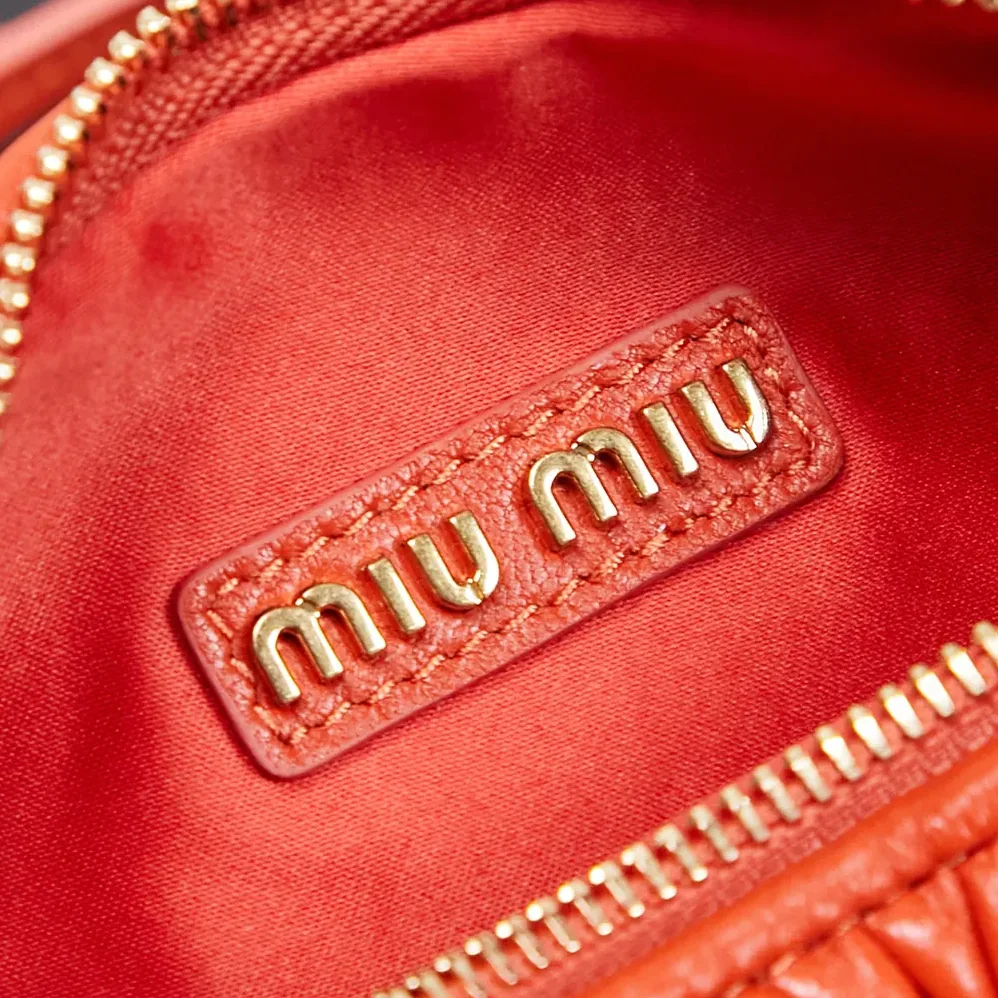 Miu Miu Wander Matelassé Nappa Leather Hobo Bag for Women in Orange Miu Miu Wander Matelassé Nappa Leather Hobo Bag for Women in Orange