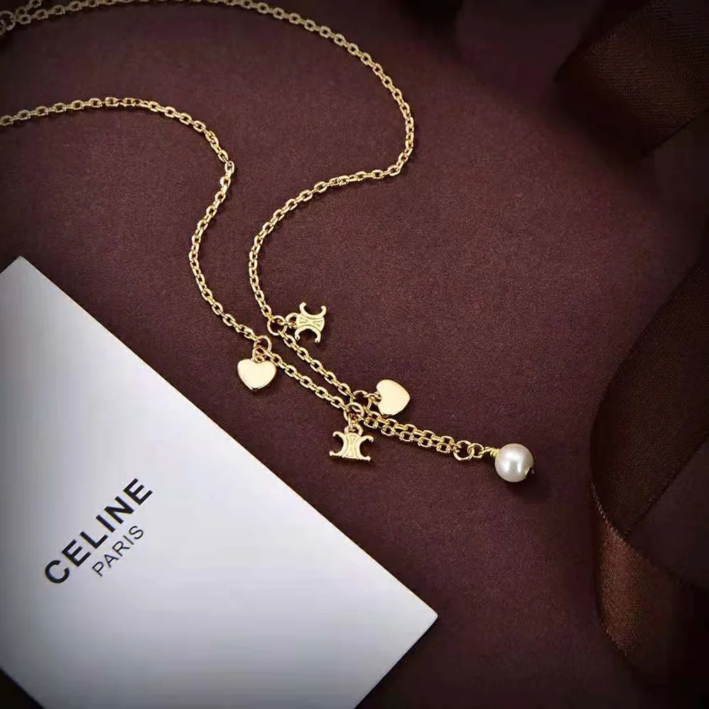 Celine Cœur Celine Charms Necklace in Brass with Gold Finish and Resin Pearl for Women Celine Cœur Celine Charms Necklace in Brass with Gold Finish and Resin Pearl for Women