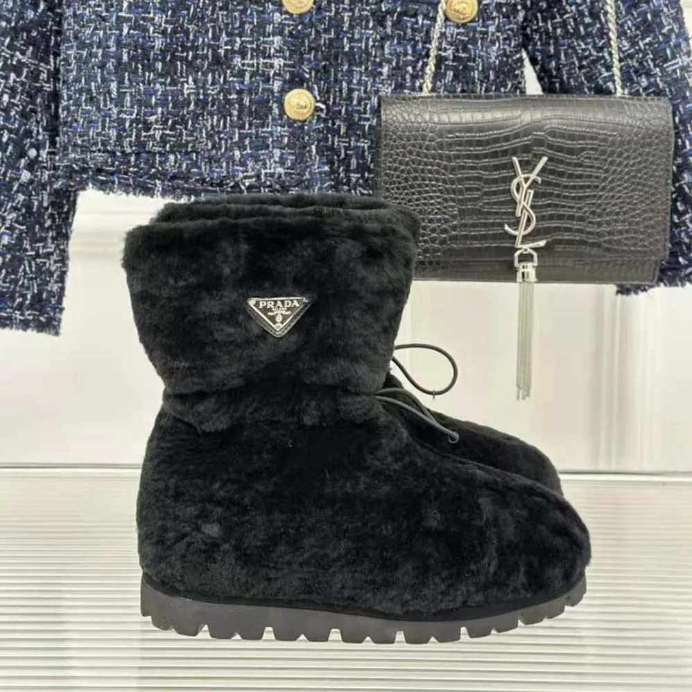 Prada Shearling Booties with Enameled Metal Triangle Logo for Women in Black