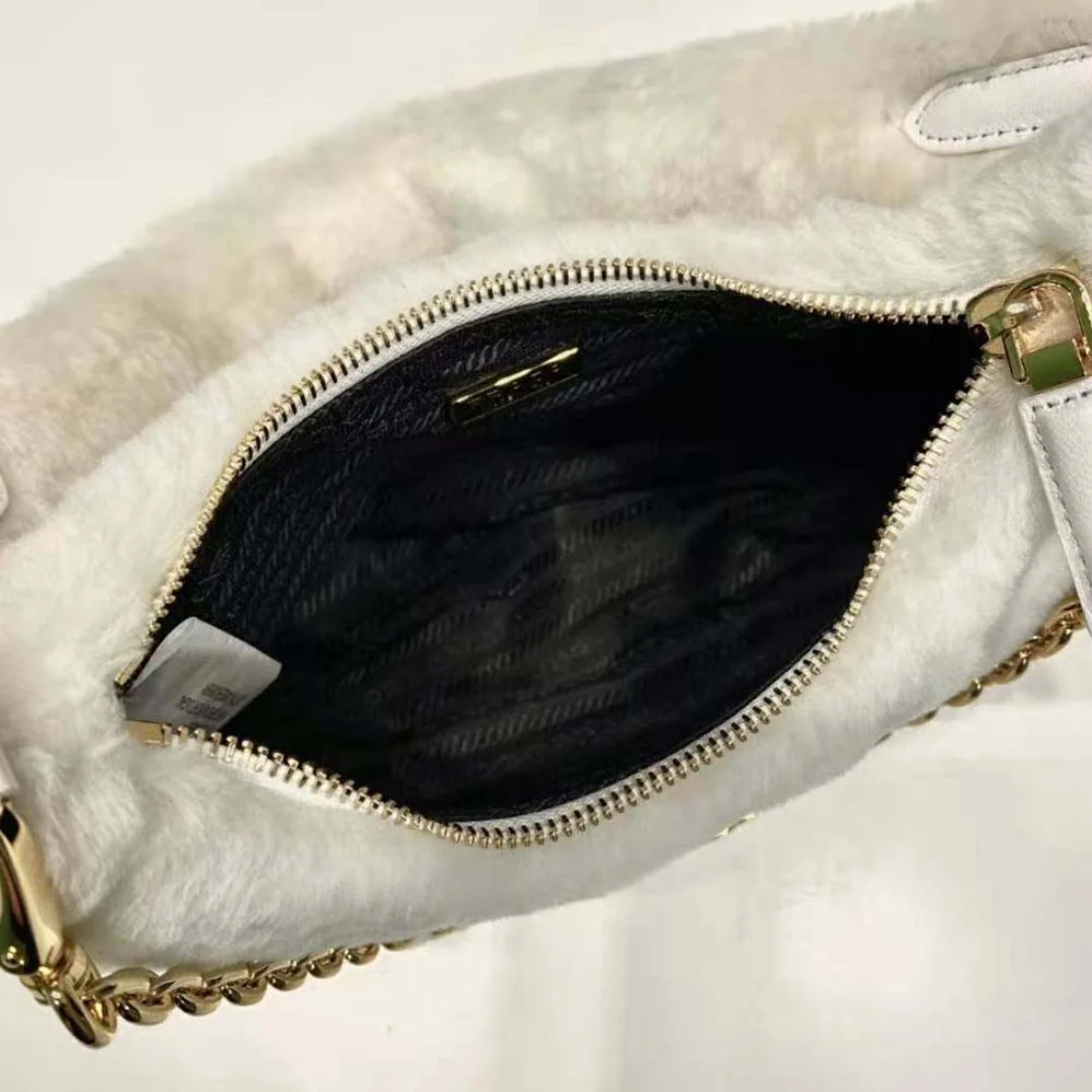 Prada Shearling Mini-Bag with the Enameled Metal Triangle Logo for Women in White Prada Shearling Mini-Bag with the Enameled Metal Triangle Logo for Women in White