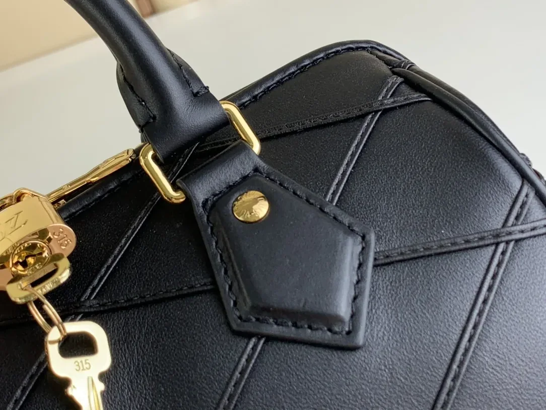 Louis Vuitton Speedy Bandouliere 25 Top Handle Bag in Black Gold Hardware