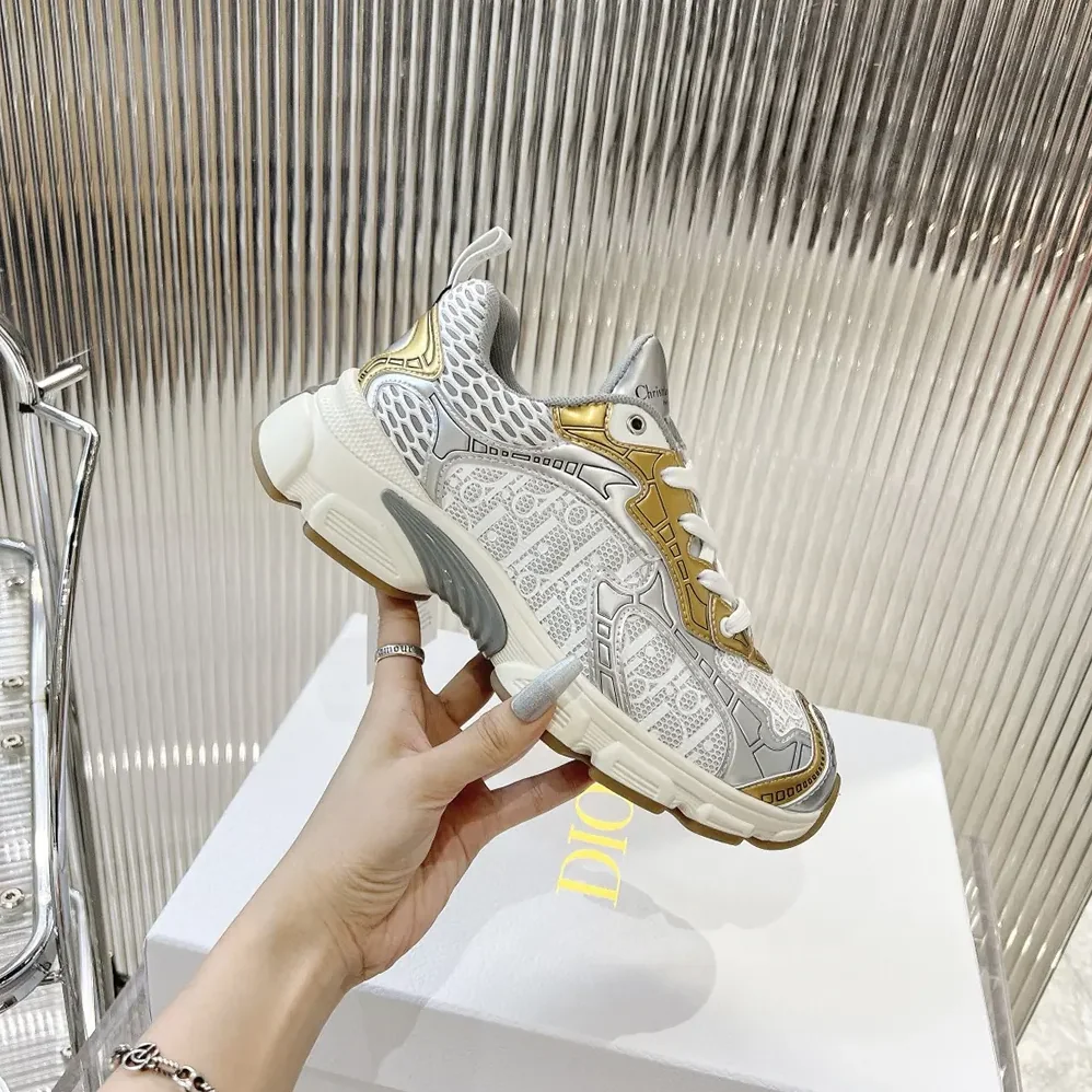 Dior Vibe Sneaker White Mesh Printed with Dior Oblique Motif and Gold- and Silver in Tone Dior Vibe Sneaker White Mesh Printed with Dior Oblique Motif and Gold- and Silver in Tone