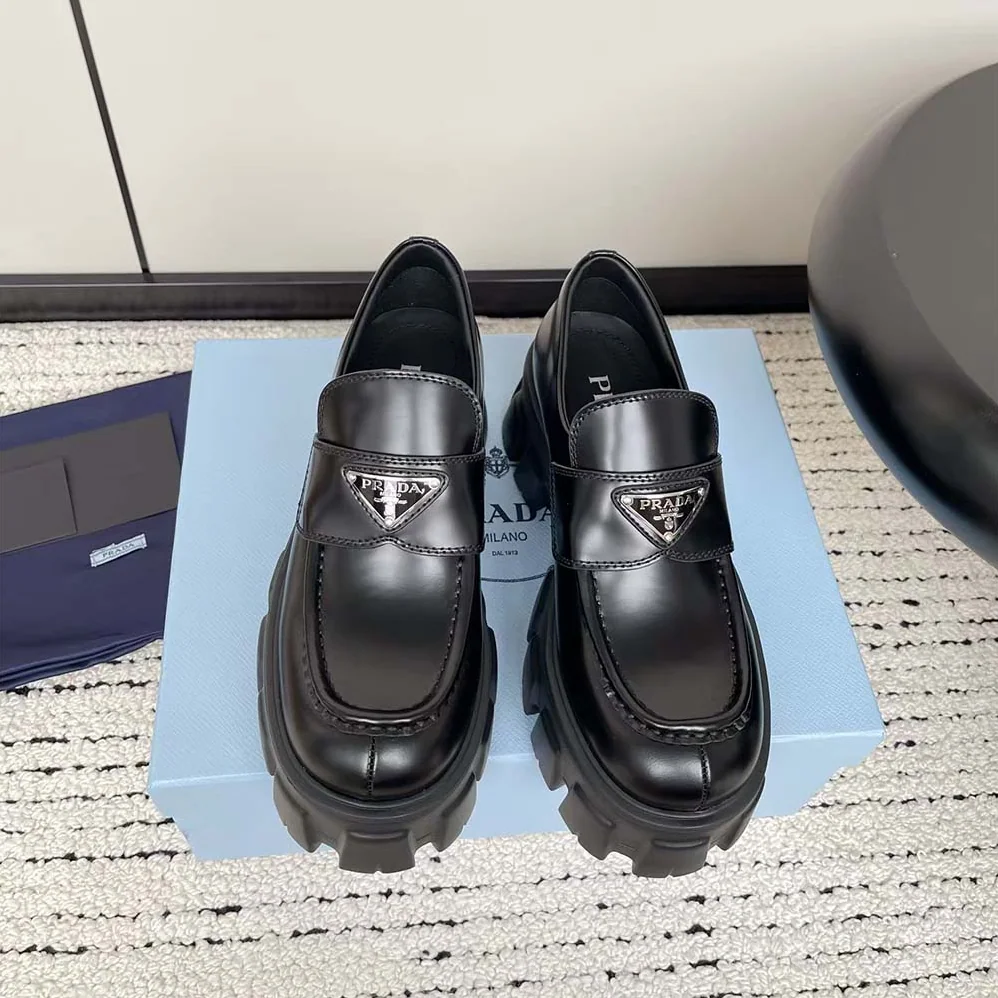 Prada Brushed Leather Monolith Loafers for Unisex in Black