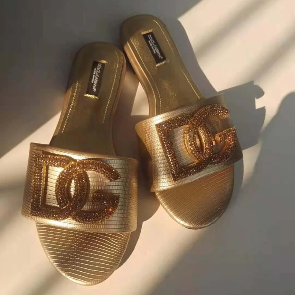 Dolce Gabbana D&G Foiled Iguana-Print Calfskin Slides with Rhinestone for Women in Detailed DG Logo Dolce Gabbana D&G Foiled Iguana-Print Calfskin Slides with Rhinestone for Women in Detailed DG Logo