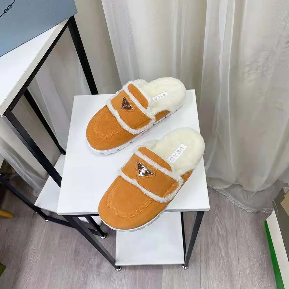 Prada Shearling Slippers Enameled Metal Triangle Logo for Women in Yellow Prada Shearling Slippers Enameled Metal Triangle Logo for Women in Yellow