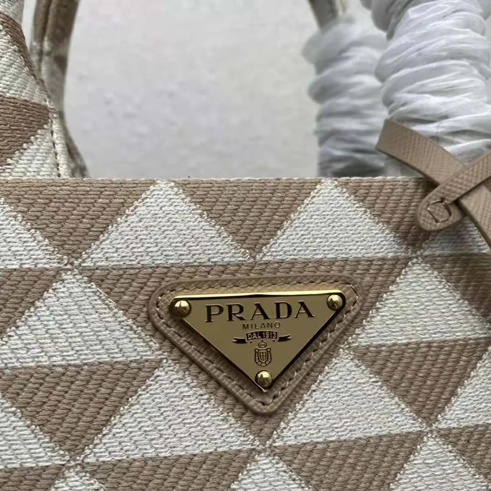 Prada Small Prada Symbole Embroidered Fabric Handbag for Women in Beige