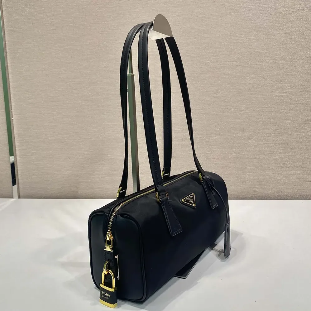 Prada Re-Nylon and Leather Medium Top-handle Bag with Padlock for Women in Black Prada Re-Nylon and Leather Medium Top-handle Bag with Padlock for Women in Black