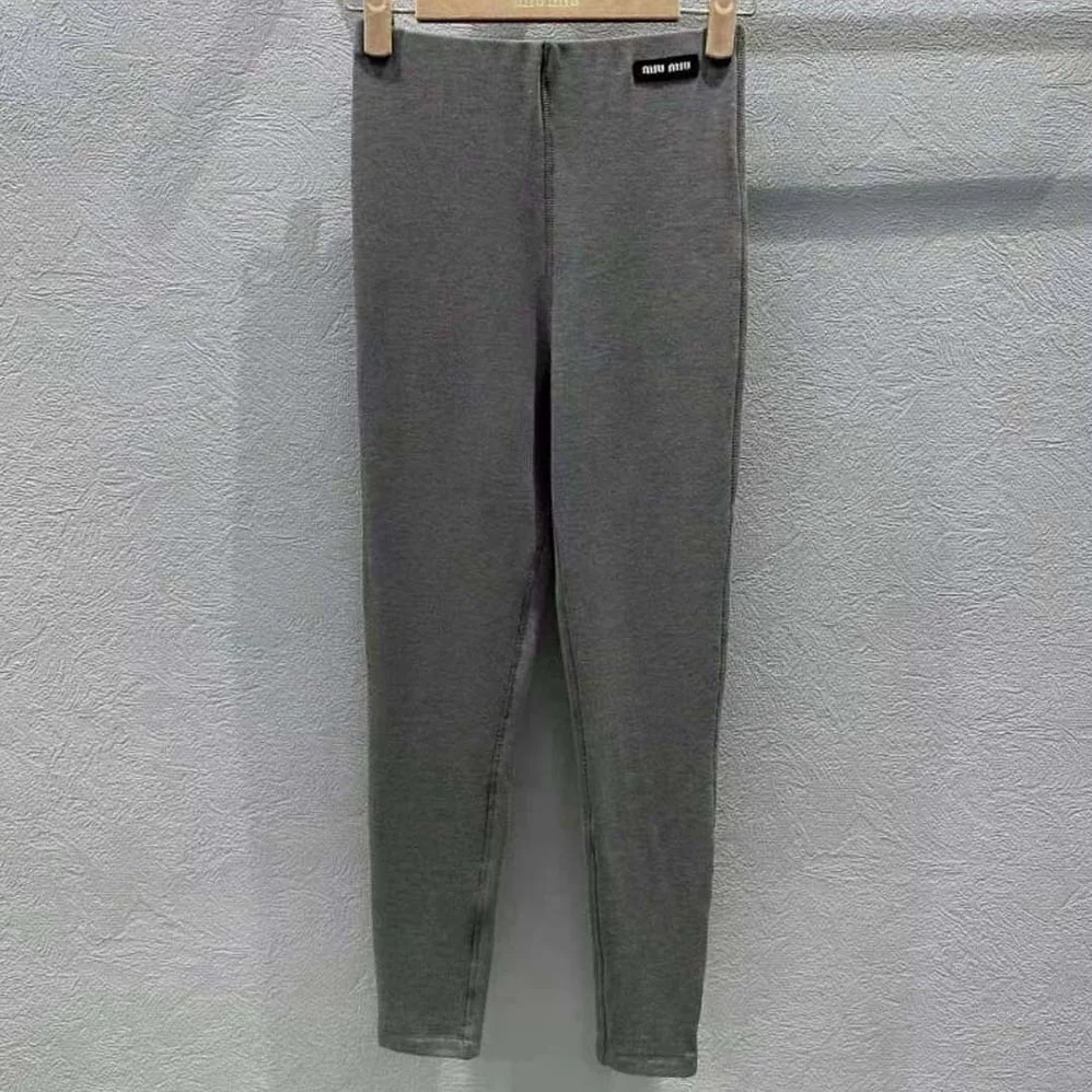 Miu Miu Silk Jersey Pants with Logo Patch for Women in Gray