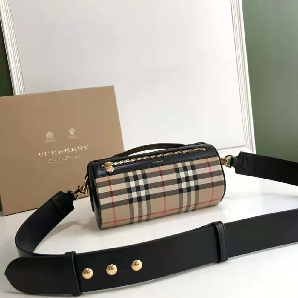 Burberry The Icon Stripe E-canvas and Leather Barrel Bag for Women in Brown Burberry The Icon Stripe E-canvas and Leather Barrel Bag for Women in Brown