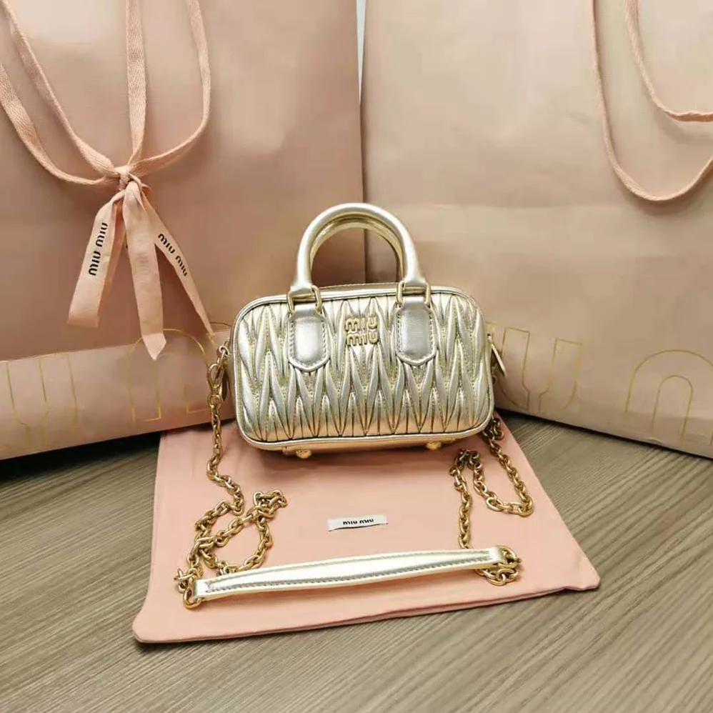 Miu Miu Matelassé Nappa Leather Top-Handle Mini-Bag for Women in Gold