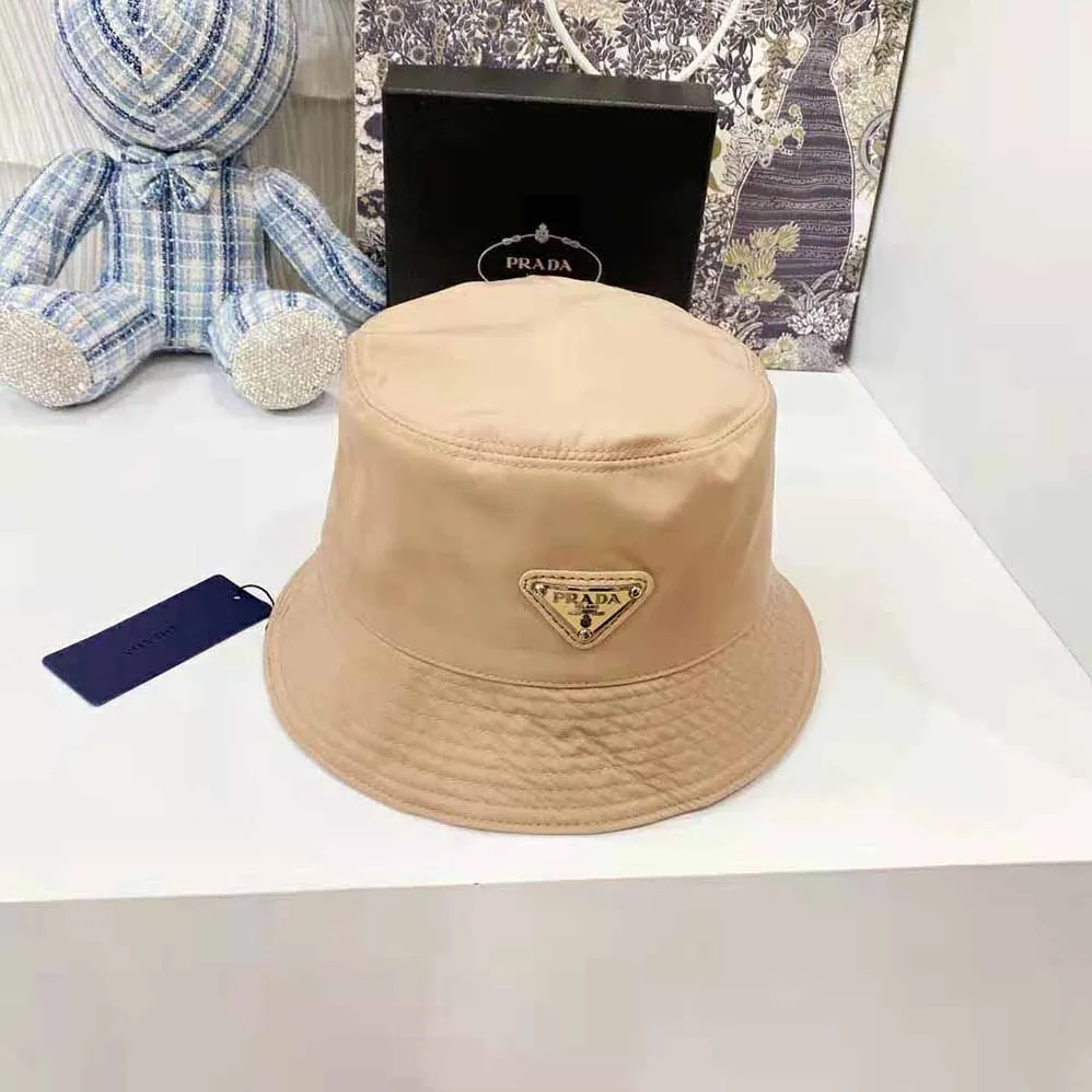 Prada Nylon Bucket Hat Decorated with the Triangle Logo for Women in Sandy Prada Nylon Bucket Hat Decorated with the Triangle Logo for Women in Sandy
