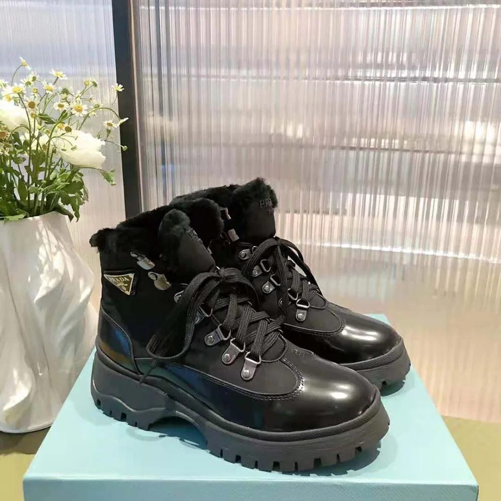 Prada Brixxen Leather and Nylon Booties for Women in Black
