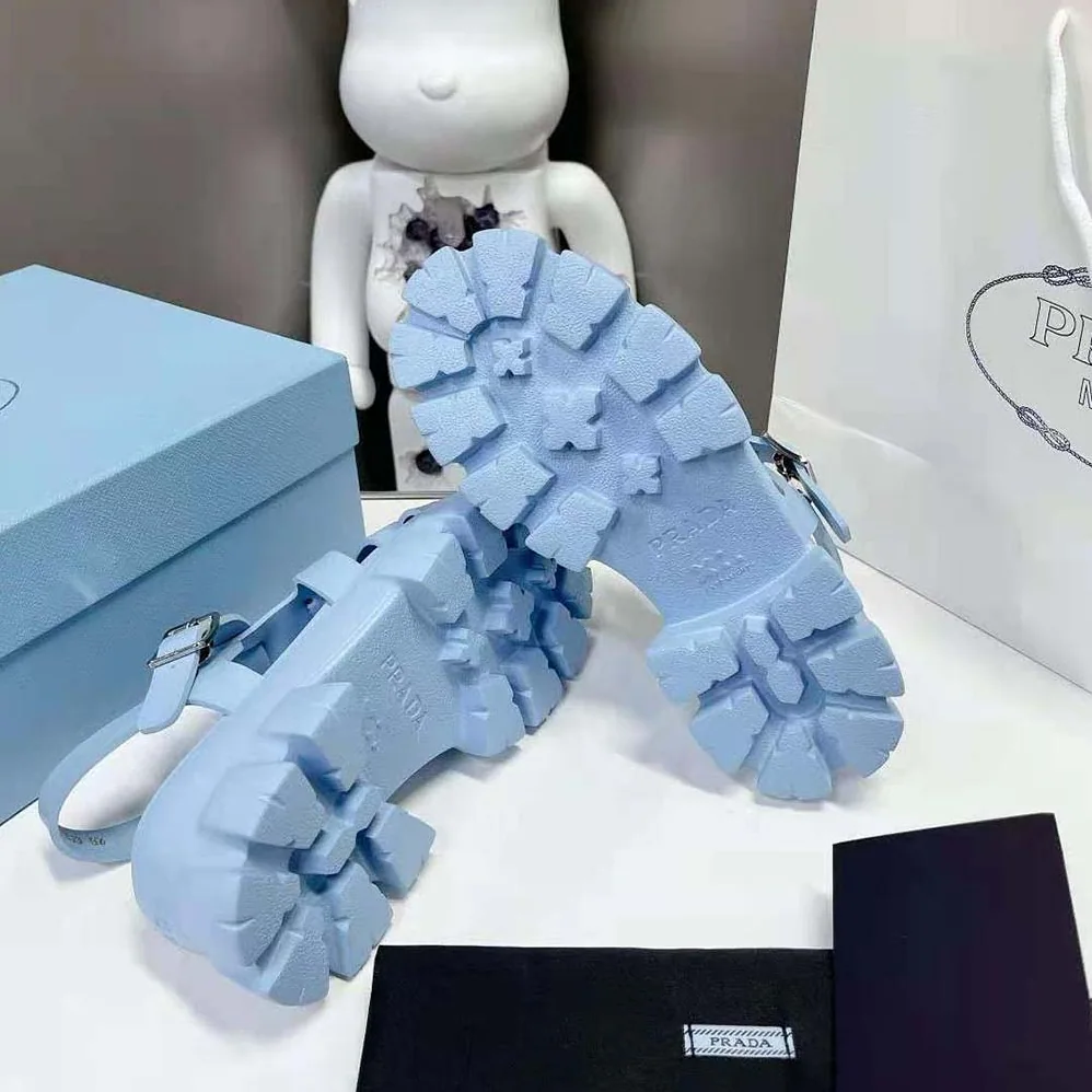 Prada Foam Rubber Sandals with Enameled Metal Triangle Logo for Women in Blue Prada Foam Rubber Sandals with Enameled Metal Triangle Logo for Women in Blue
