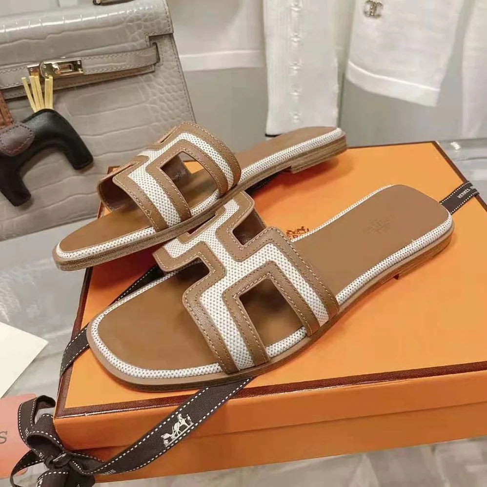 Hermes Oran Sandal in Calfskin and H Canvas with Iconic H Cut for Women in Out Hermes Oran Sandal in Calfskin and H Canvas with Iconic H Cut for Women in Out