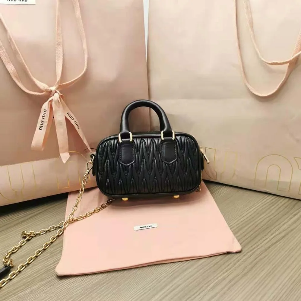 Miu Miu Matelassé Nappa Leather Top-Handle Mini-Bag for Women in Black Miu Miu Matelassé Nappa Leather Top-Handle Mini-Bag for Women in Black