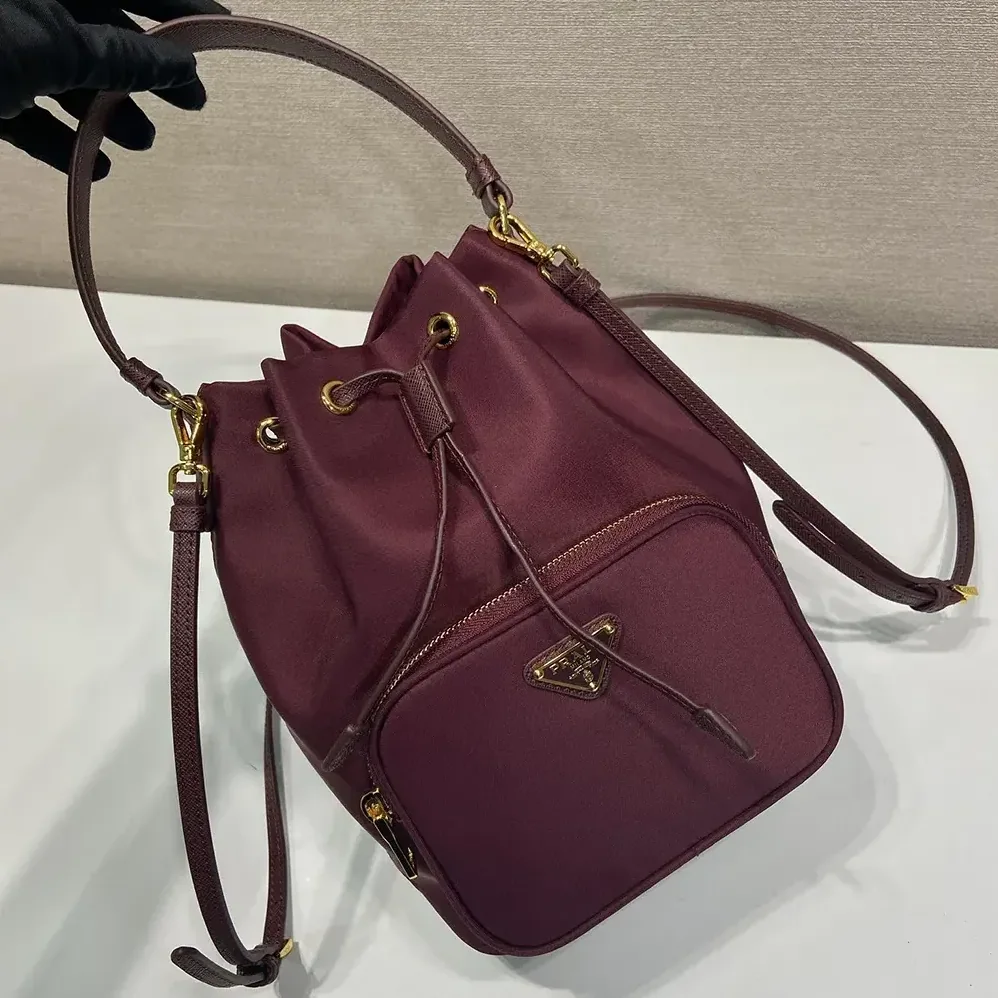 Prada Duet Re-Nylon Bucket Bag for Women in Maroon Prada Duet Re-Nylon Bucket Bag for Women in Maroon