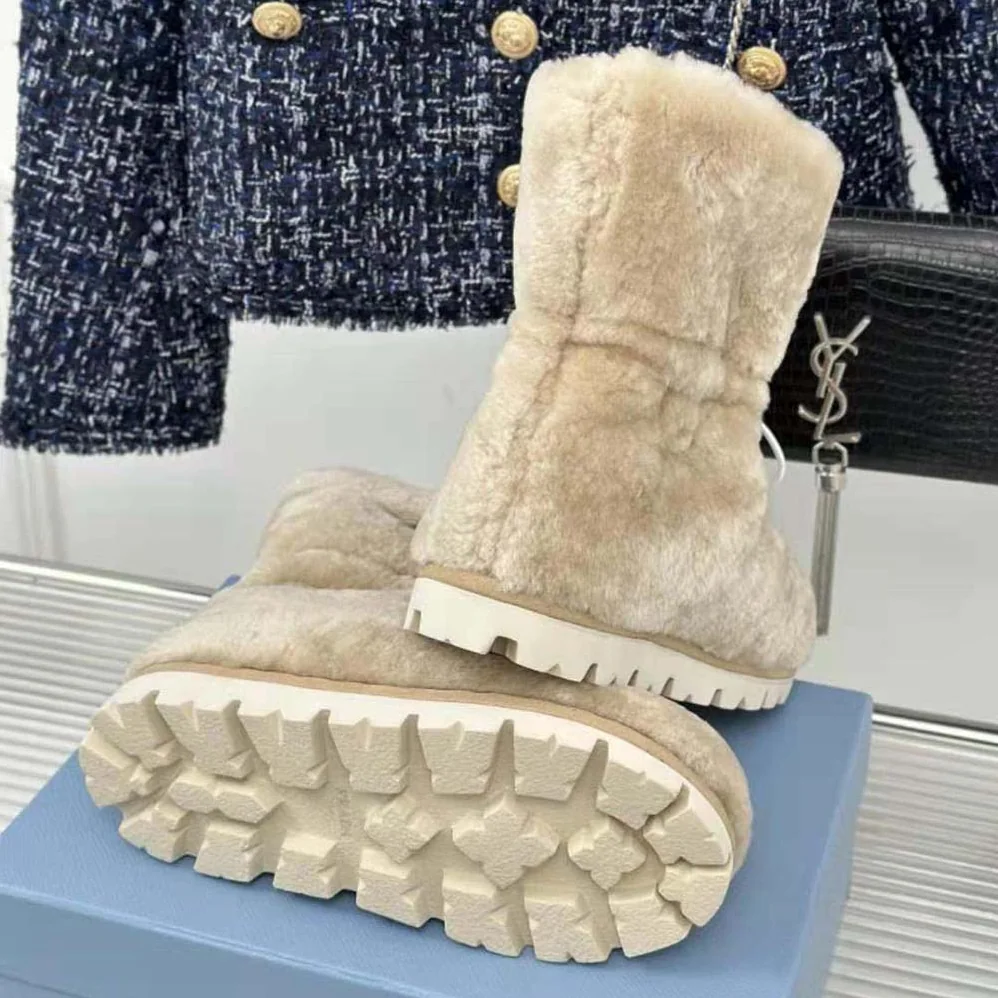 Prada Shearling Booties with Enameled Metal Triangle Logo for Women in Beige
