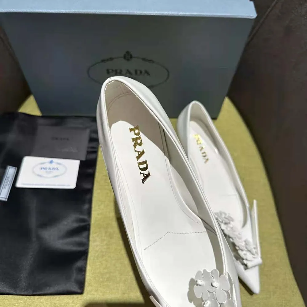 Prada Brushed Leather Pumps with Floral Appliqués for Women in White