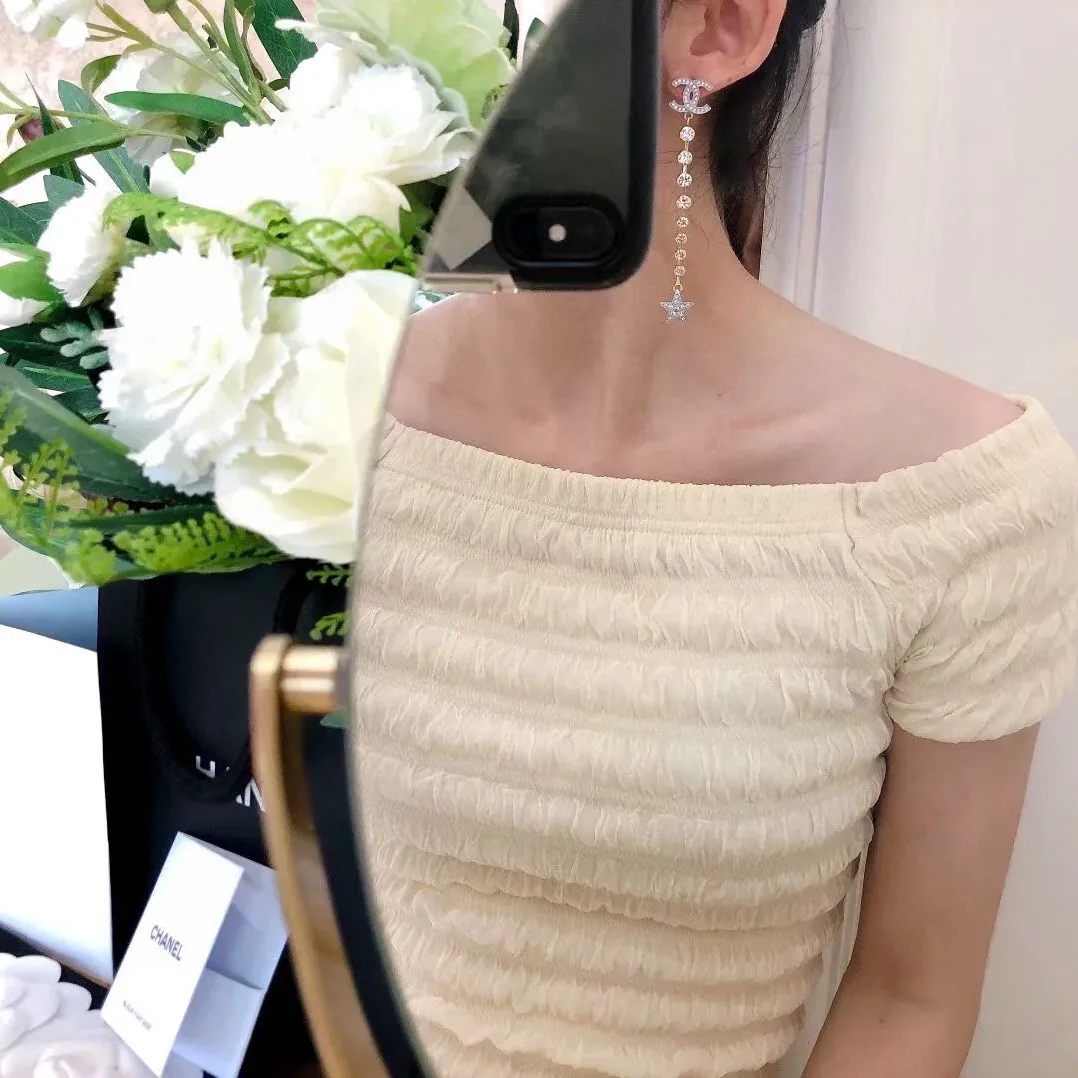Chanel Long Star Earrings Gold Chanel Long Star Earrings Gold
