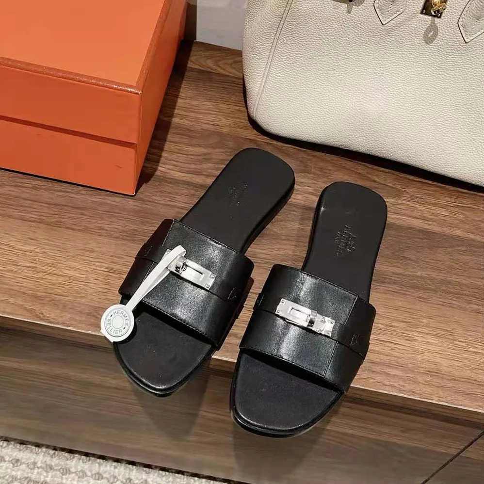 Hermes Giulia Sandal in Calfskin with Iconic Palladium-Plated Kelly Buckle for Women in Black Hermes Giulia Sandal in Calfskin with Iconic Palladium-Plated Kelly Buckle for Women in Black