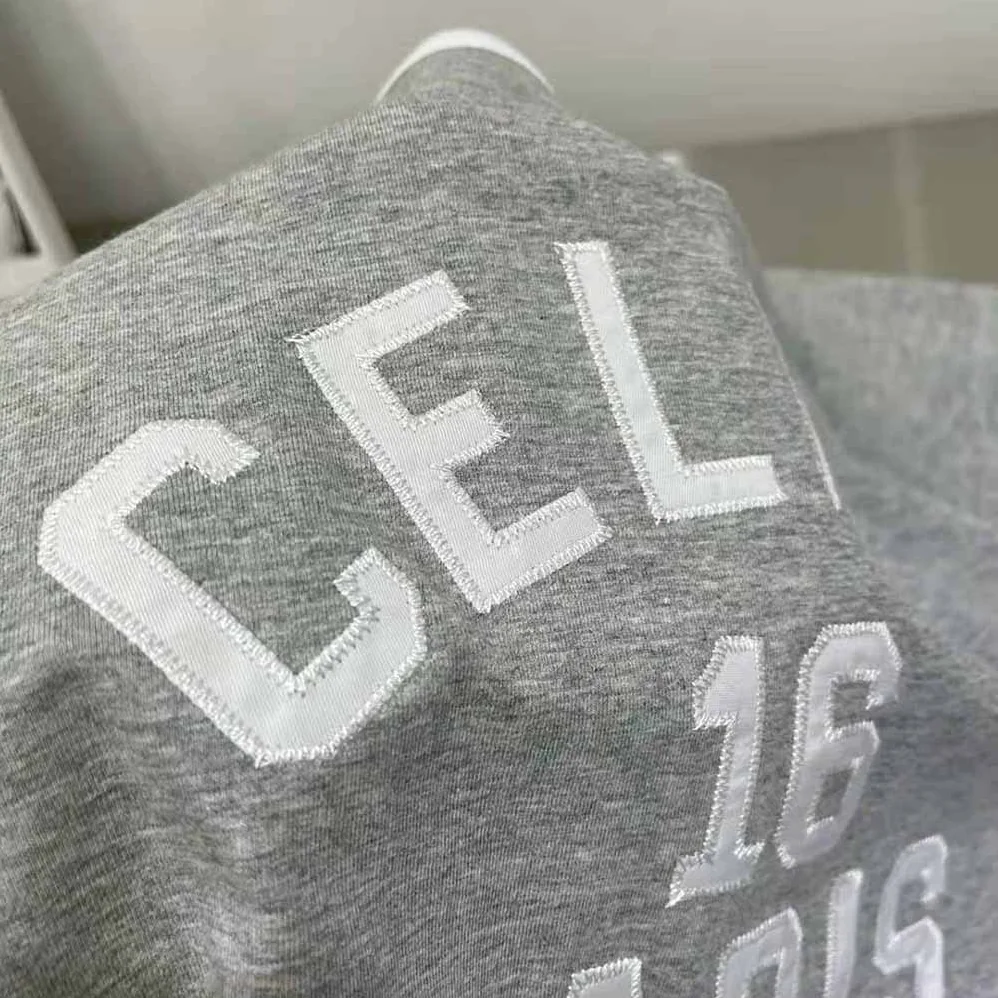 Celine Embroidered Celine 16 T-shirt in Cotton Jersey for Women in Silver Celine Embroidered Celine 16 T-shirt in Cotton Jersey for Women in Silver