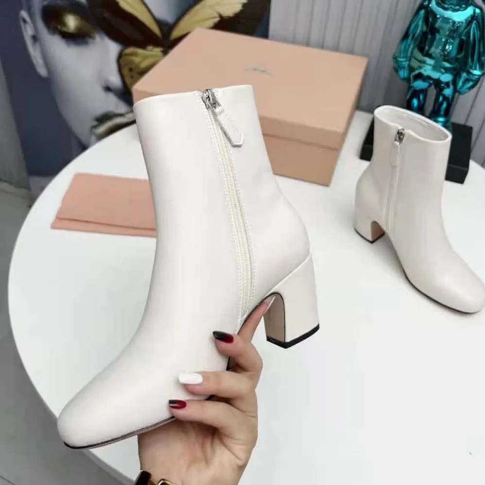 Miu Miu Leather Booties with Metal Lettering Logo for Women in White