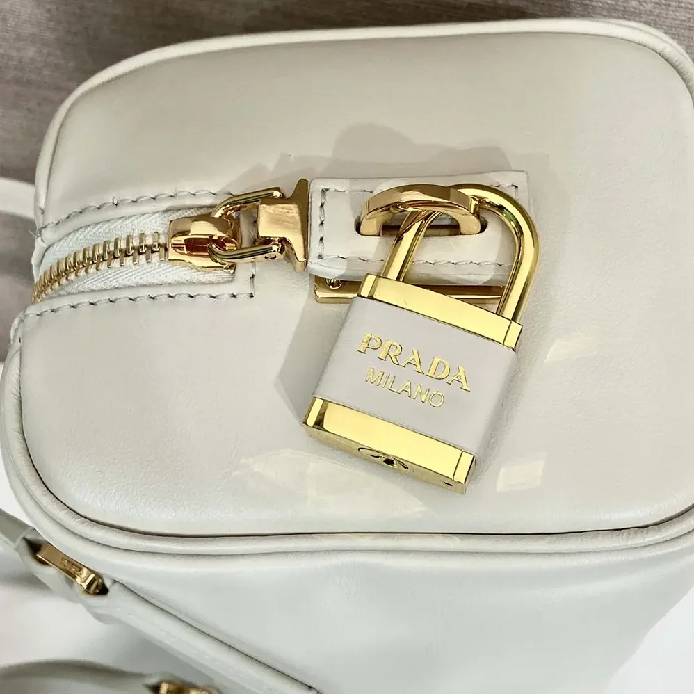 Prada Medium Leather Top-handle Bag with Padlock for Women in White Prada Medium Leather Top-handle Bag with Padlock for Women in White