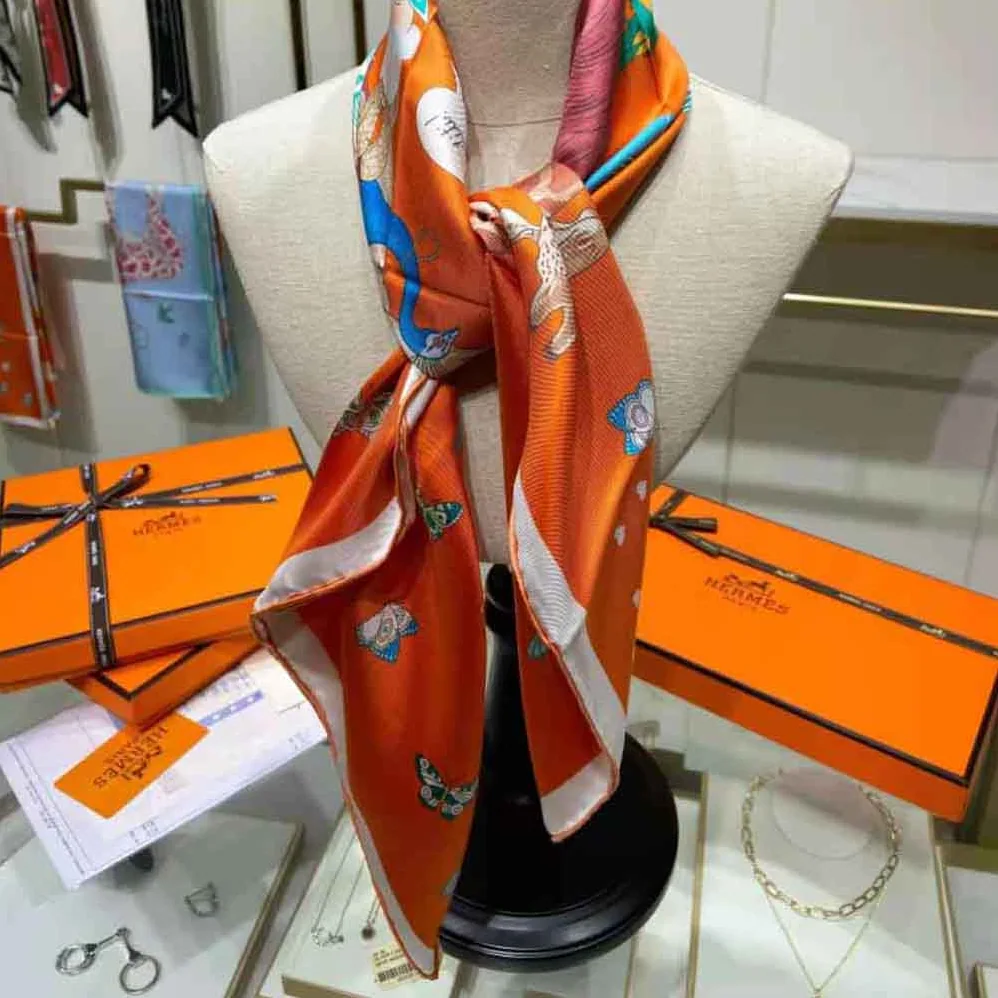 Hermes Hermes Story Scarf 90 in Silk Twill with Hand-Rolled Edges for Women in Orange