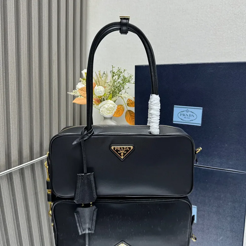 Prada Re-Nylon and Leather Small Top for Women in handle Bag with Padlock Prada Re-Nylon and Leather Small Top for Women in handle Bag with Padlock