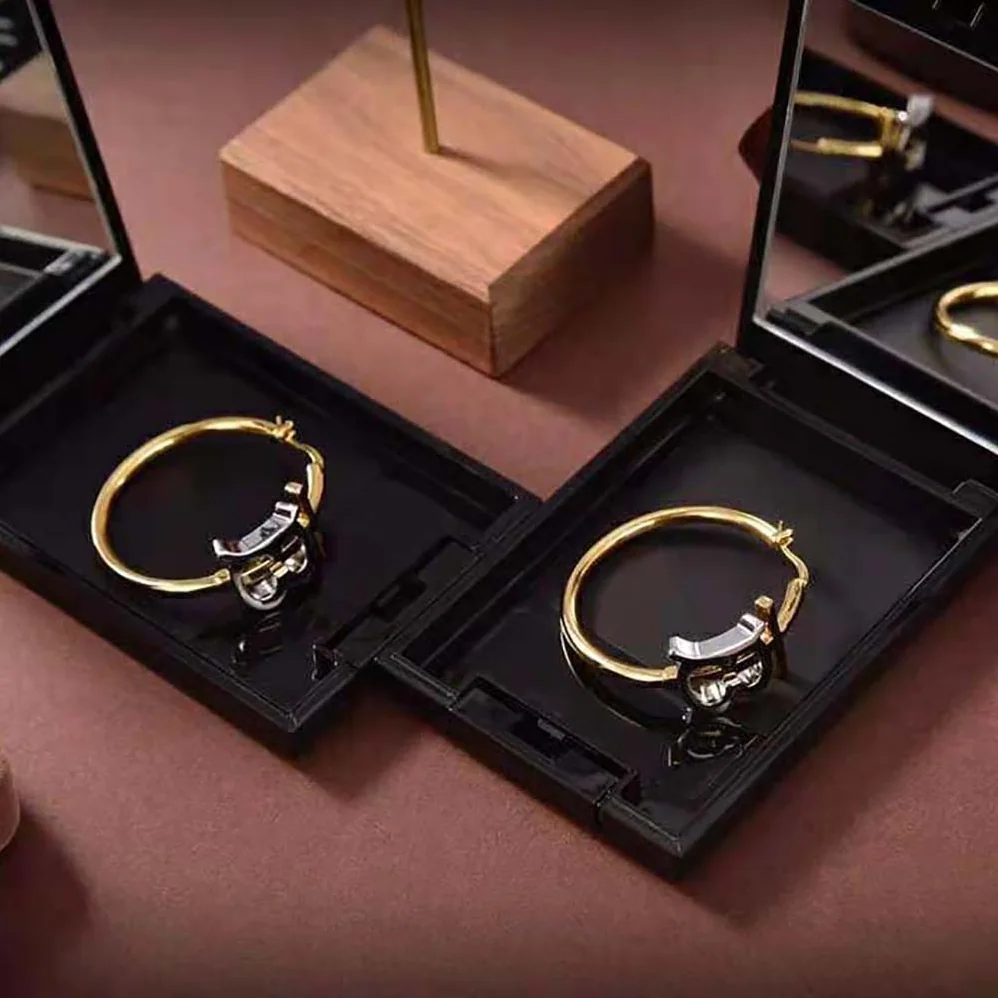Burberry Gold and Palladium for Women in plated Monogram Motif Earrings Burberry Gold and Palladium for Women in plated Monogram Motif Earrings