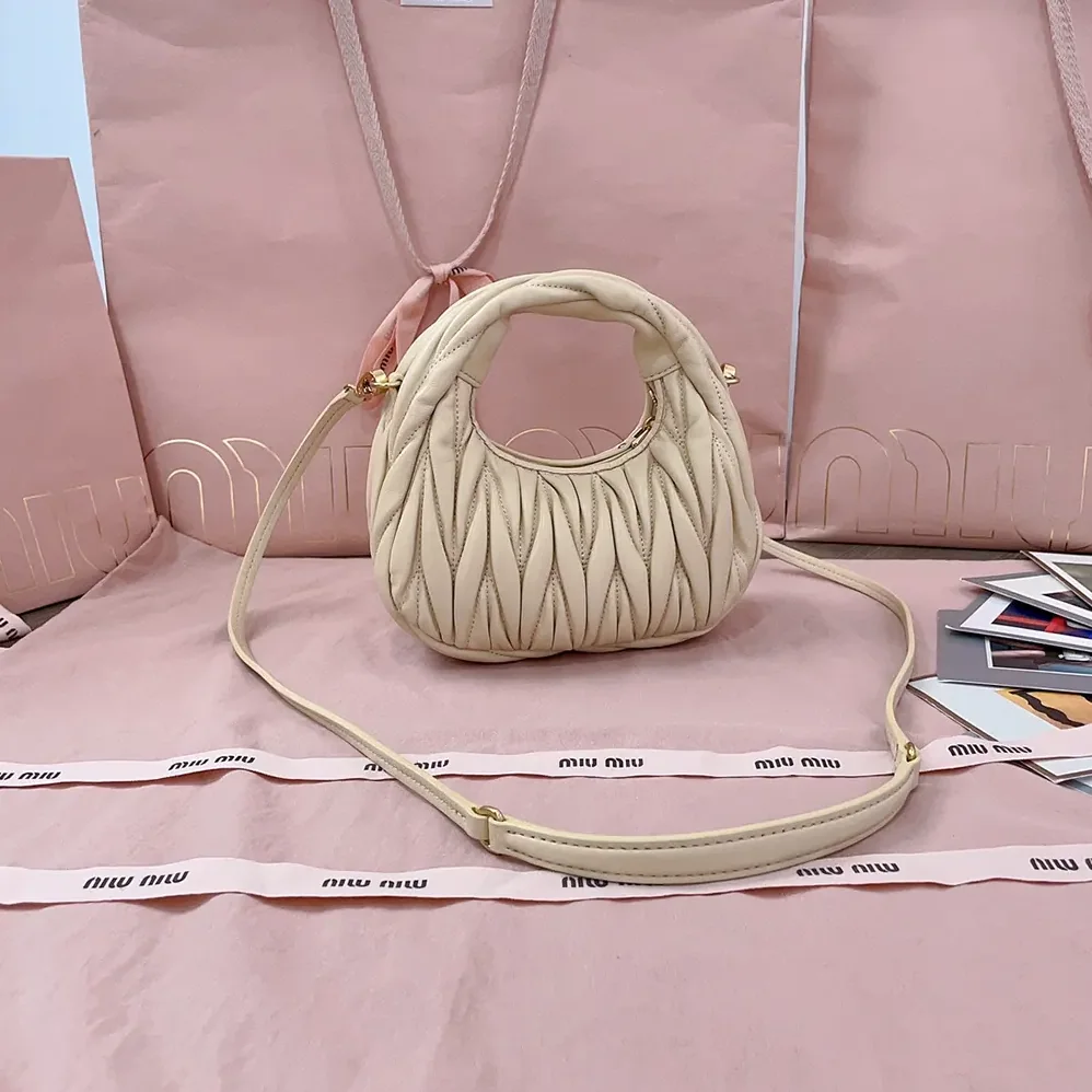 Miu Miu Wander Matelassé Nappa Leather Hobo Mini-Bag for Women in Light Yellow Miu Miu Wander Matelassé Nappa Leather Hobo Mini-Bag for Women in Light Yellow