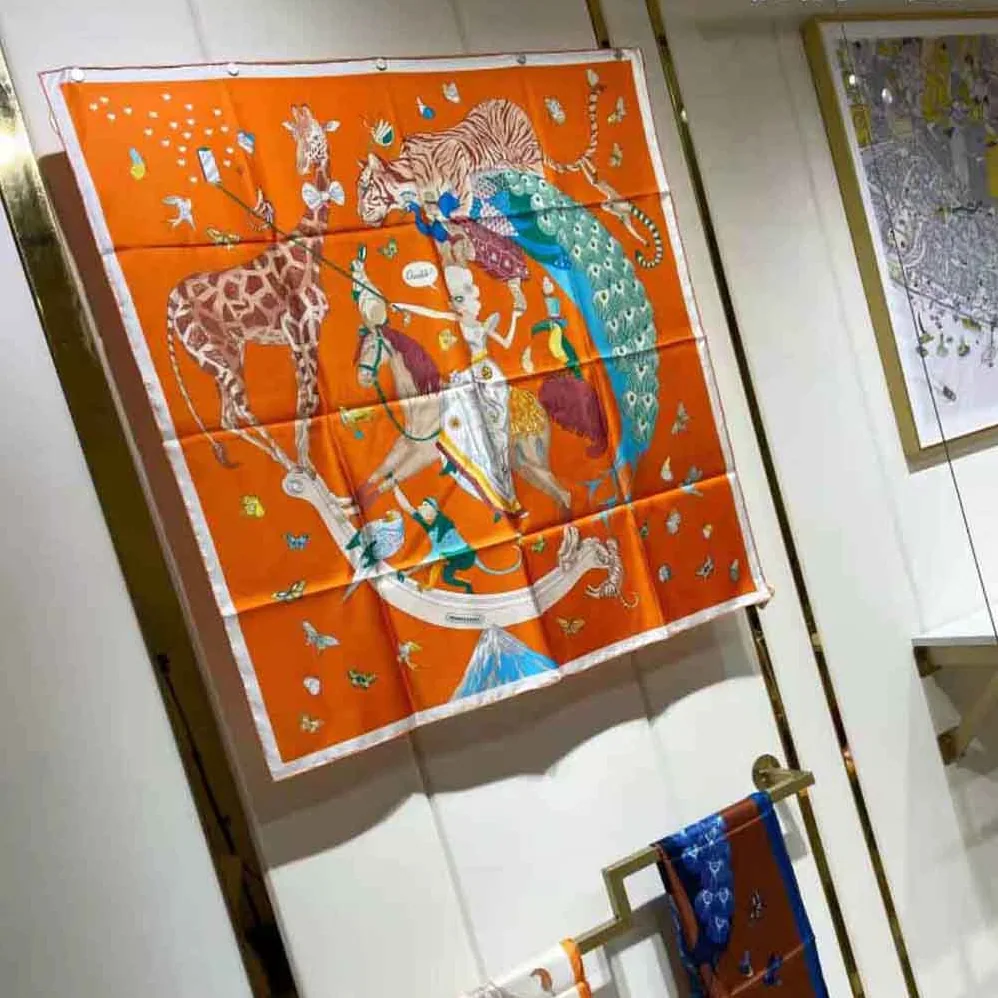 Hermes Hermes Story Scarf 90 in Silk Twill with Hand-Rolled Edges for Women in Orange
