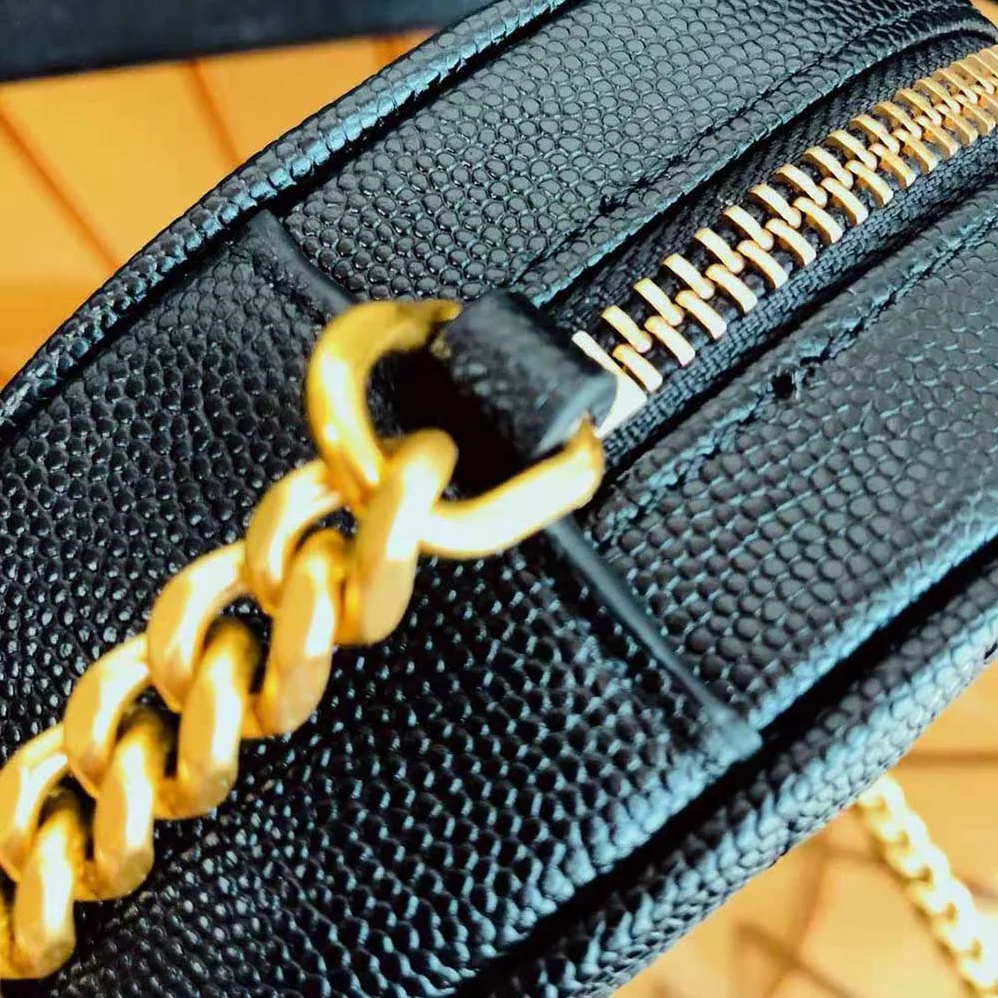 Saint Laurent YSL Vinyle Round Camera Bag in Chevron-Quilted Grain de Poudre Embossed Leather for Women in Black Saint Laurent YSL Vinyle Round Camera Bag in Chevron-Quilted Grain de Poudre Embossed Leather for Women in Black