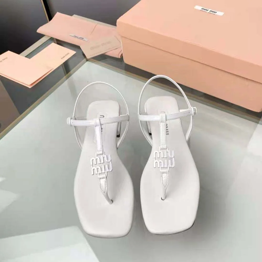 Miu Miu Patent Thong Sandals with Metal Lettering Logo for Women in White Miu Miu Patent Thong Sandals with Metal Lettering Logo for Women in White