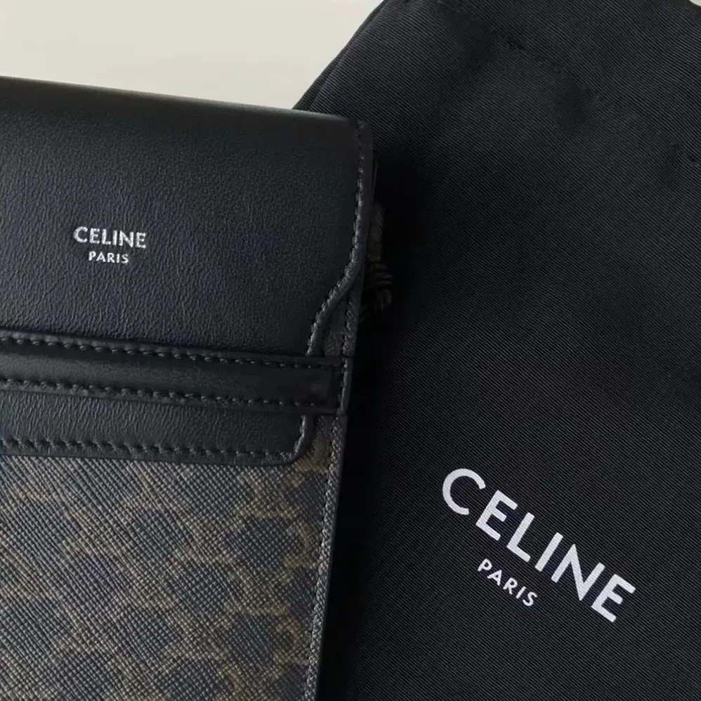 Celine Phone Pouch with Flap in Triomphe Canvas and Lambskin for Women in Black Celine Phone Pouch with Flap in Triomphe Canvas and Lambskin for Women in Black