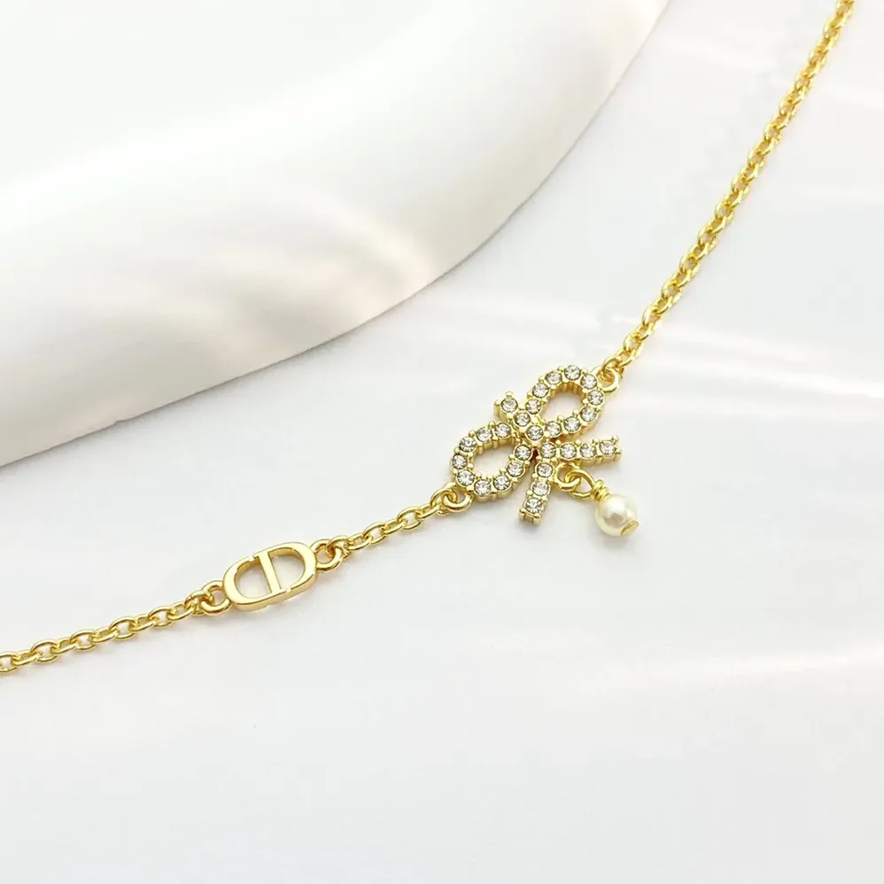 Dior Le Nœud de Dior Necklace Gold-Finish Metal with White Resin Pearl and Silver for Women in Tone Crystals Dior Le Nœud de Dior Necklace Gold-Finish Metal with White Resin Pearl and Silver for Women in Tone Crystals