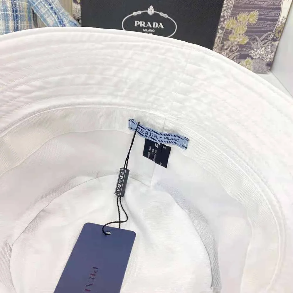 Prada Nylon Bucket Hat Decorated with the Triangle Logo for Women in White Prada Nylon Bucket Hat Decorated with the Triangle Logo for Women in White
