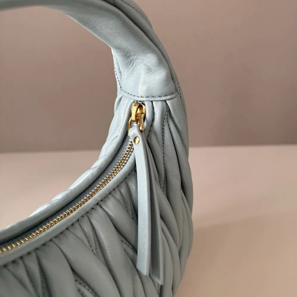 Miu Miu Wander Matelassé Nappa Leather Hobo Bag for Women in Powder Blue Miu Miu Wander Matelassé Nappa Leather Hobo Bag for Women in Powder Blue