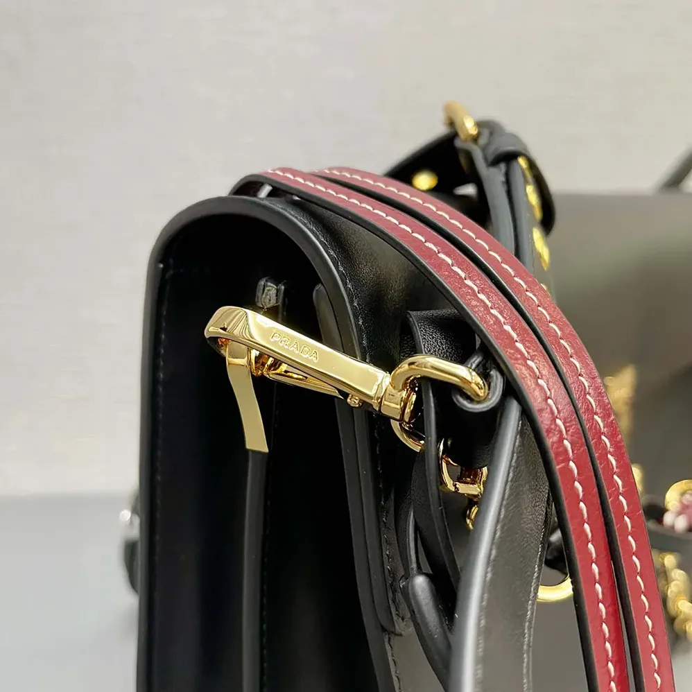 Prada Soft Sound Large Leather Shoulder Bag with Charms for Women in Black