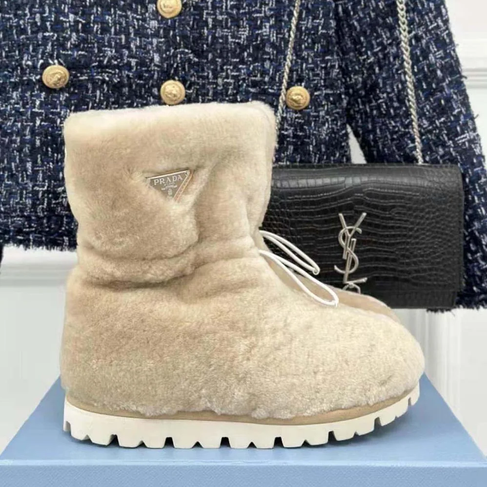 Prada Shearling Booties with Enameled Metal Triangle Logo for Women in Beige