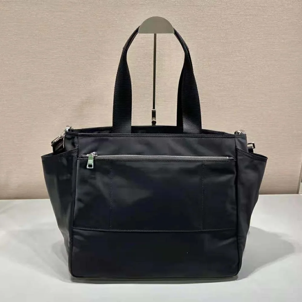 Prada Re-Nylon Baby Bag with Re-Nylon logo-Print lining for Women in Black