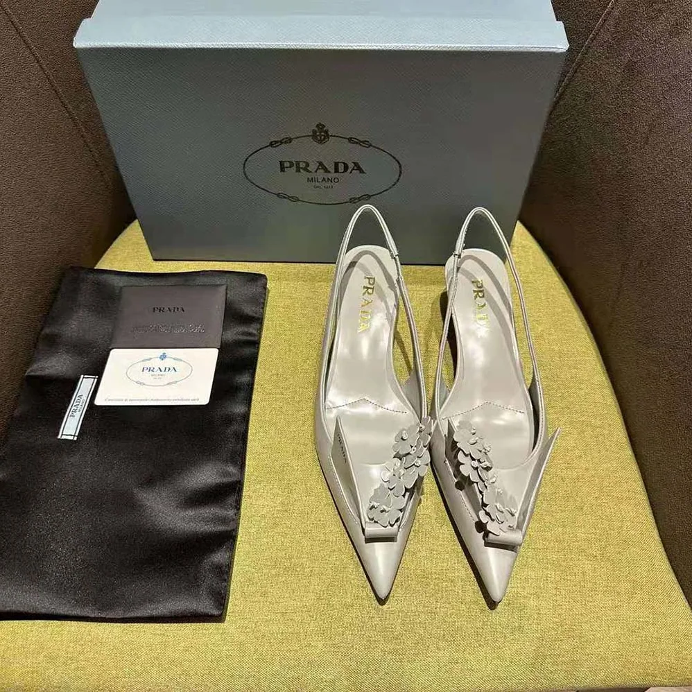 Prada Brushed Leather Slingback Pumps with Floral Appliques for Women in Gray Prada Brushed Leather Slingback Pumps with Floral Appliques for Women in Gray