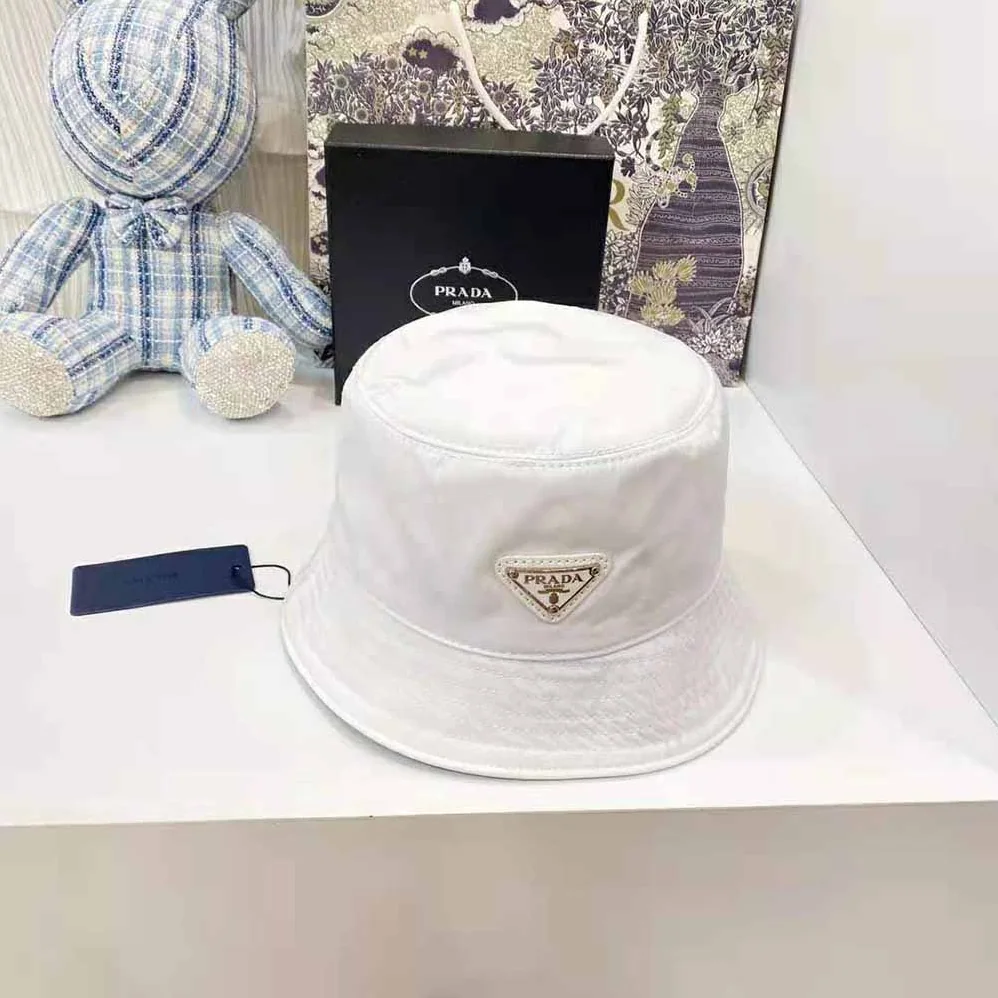 Prada Nylon Bucket Hat Decorated with the Triangle Logo for Women in White Prada Nylon Bucket Hat Decorated with the Triangle Logo for Women in White