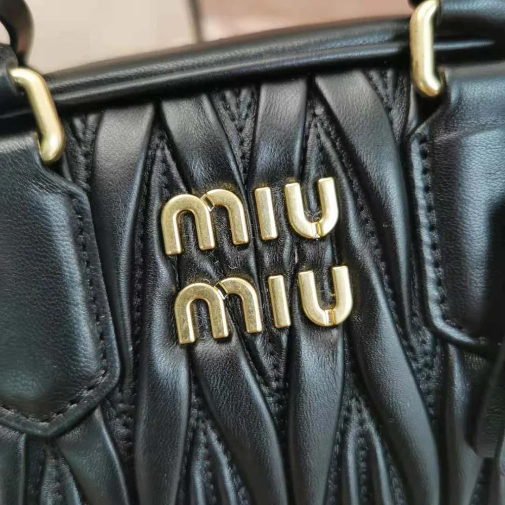 Miu Miu Matelassé Nappa Leather Top-Handle Bag for Women in Black