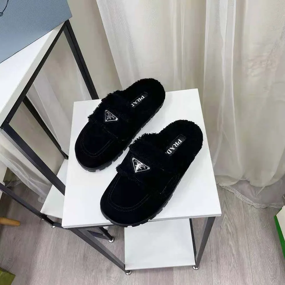 Prada Shearling Slippers Enameled Metal Triangle Logo for Women in Black