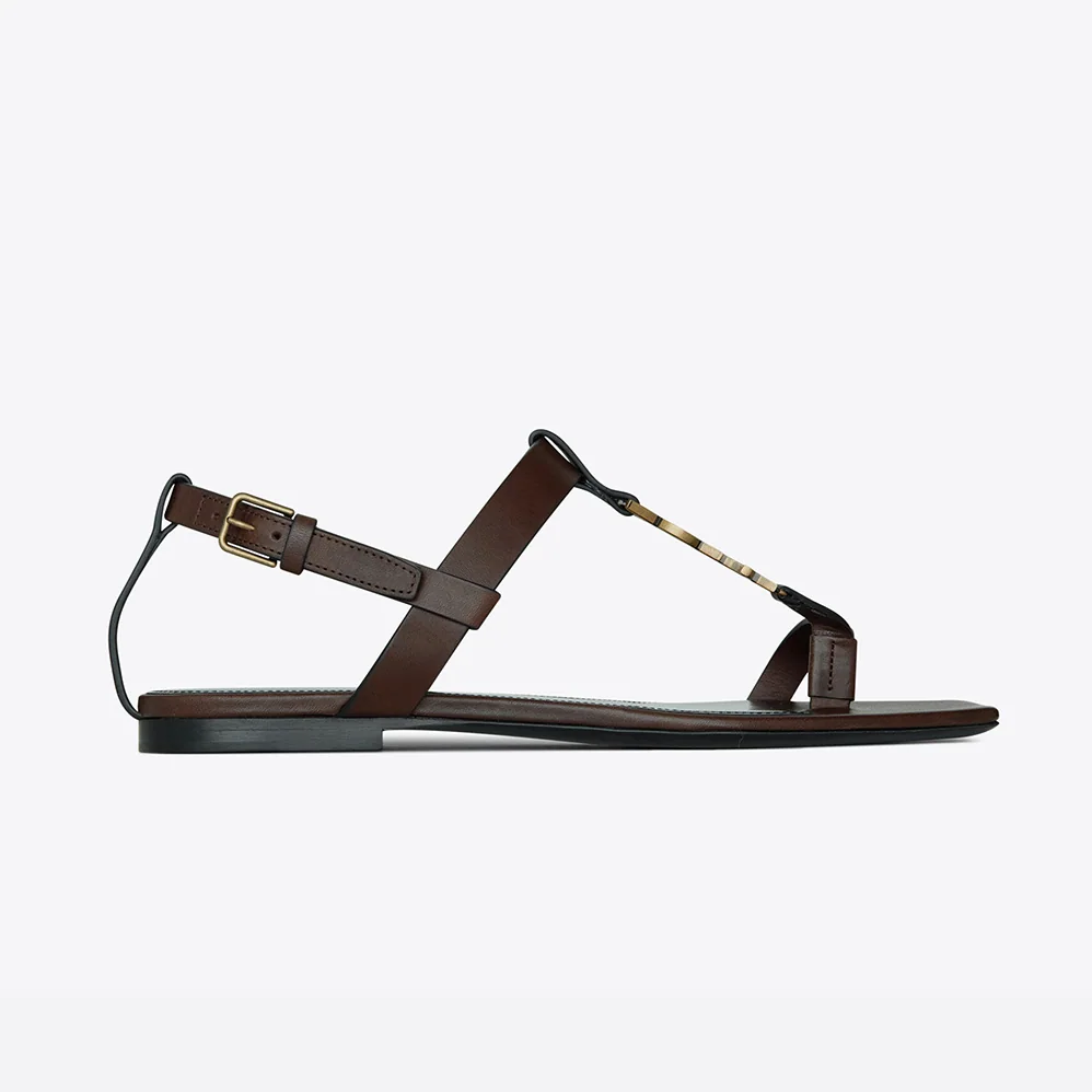 Saint Laurent YSL Cassandra Flat Sandals in Smooth Leather with Gold-Tone Monogram for Women in Brown